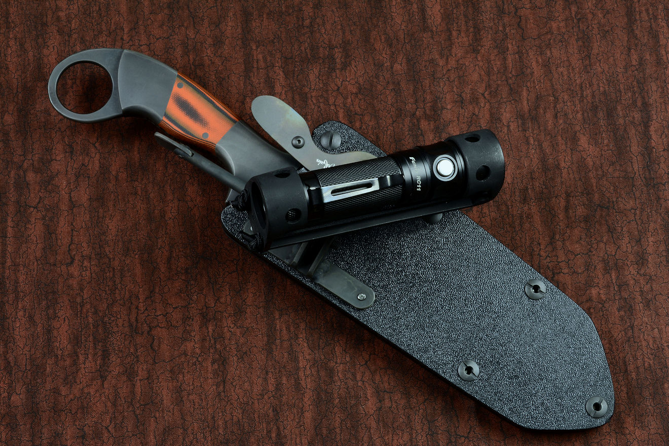 Fully articulating flashlight holder can be aimed from the sheath position