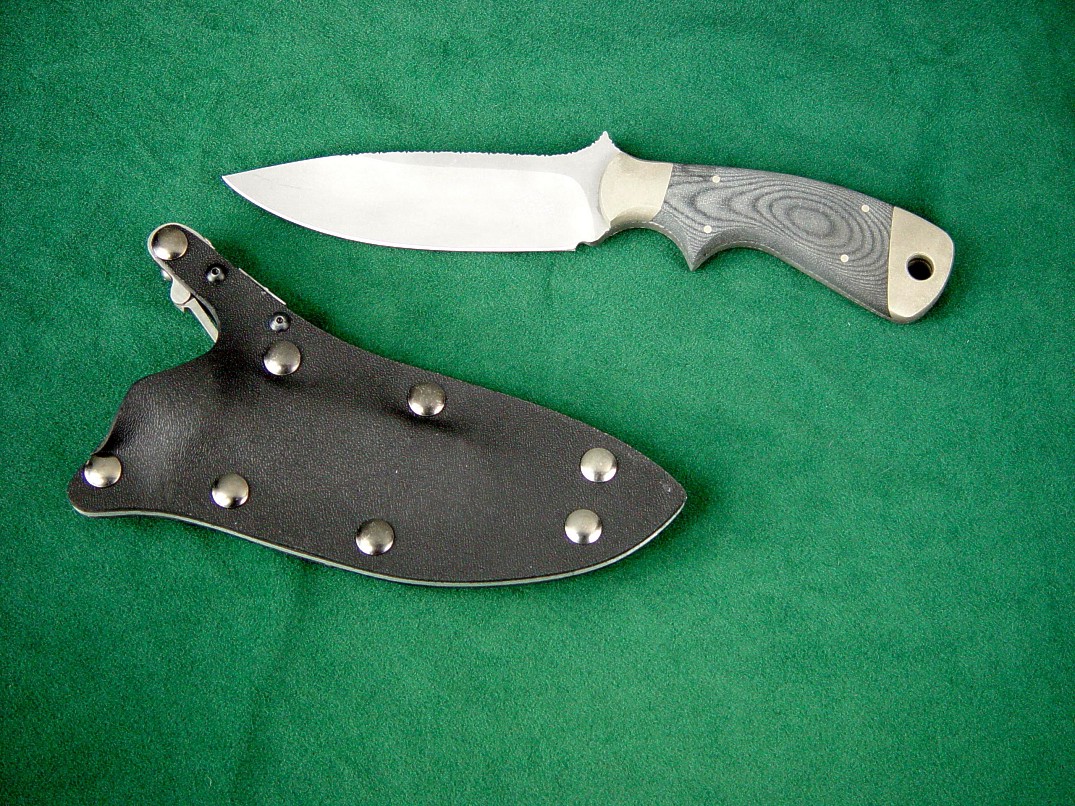 "Creature" fine tactical, CSAR, combat knife, obverse side view in bead blasted 440C high chromium stainless steel blade, nickel silver bolsters, canvas micarta phenolic handle, locking kydex, aluminum, stainless steel sheath