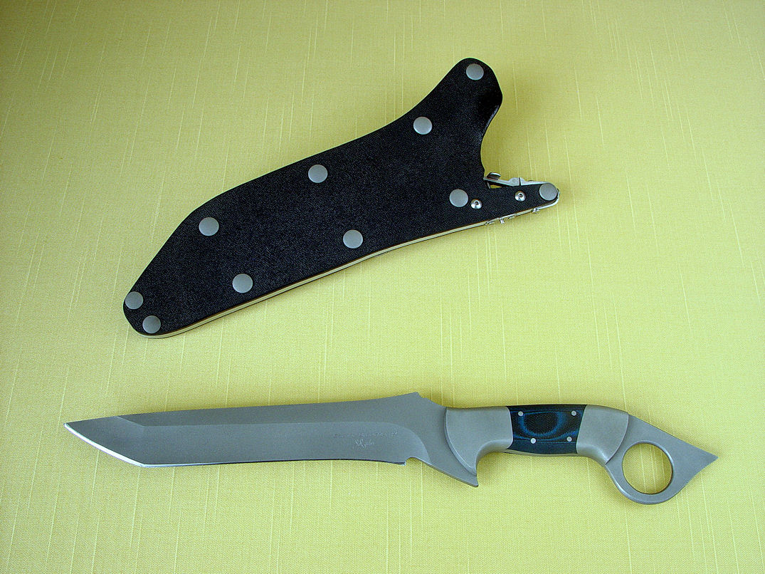 "Tien" collaborative tactical knife by Etienne Beauchamp and Jay Fisher in 440C high chromium stainless steel blade, 304 stainless steel bolsters, blue-black G10 composite handle, locking kydex, aluminum, stainless steel sheath