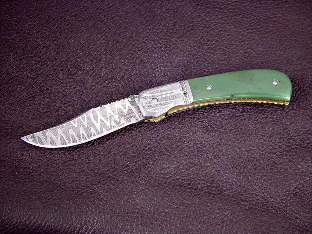 "Gemini" obverse side view: vinland pattern welded damascus blade and bolsters, Green Siberian Jade gemstone handle, anodized titanium liners