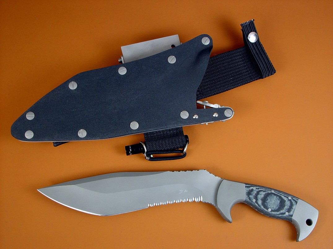 "Kneph" obverse side view in ATS-34 high molybdenum stainless steel blade, 304 stainles steel bolsters, Black and gray G10 fiberglass epoxy composite handle, locking kydex, aluminum, stainles steel sheath with full accessory package