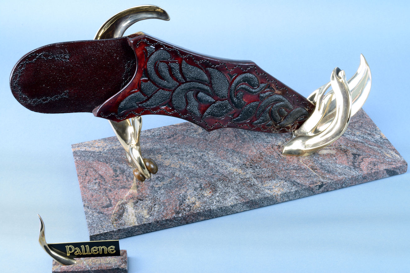 "Pallene" sheath on sculpturall stand, with over 40 inlays of black rayskin in hand-carved burgundy leather, hand-stitched with polyester