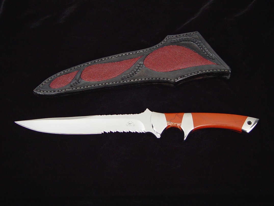 "Patriot" tactical knife, obverse side view in 440C high chromium stainless steel blade, 304 stainless steel bolsters, Red River Jasper gemstone handle, red stingray skin inlaid in hand-carved leather sheath