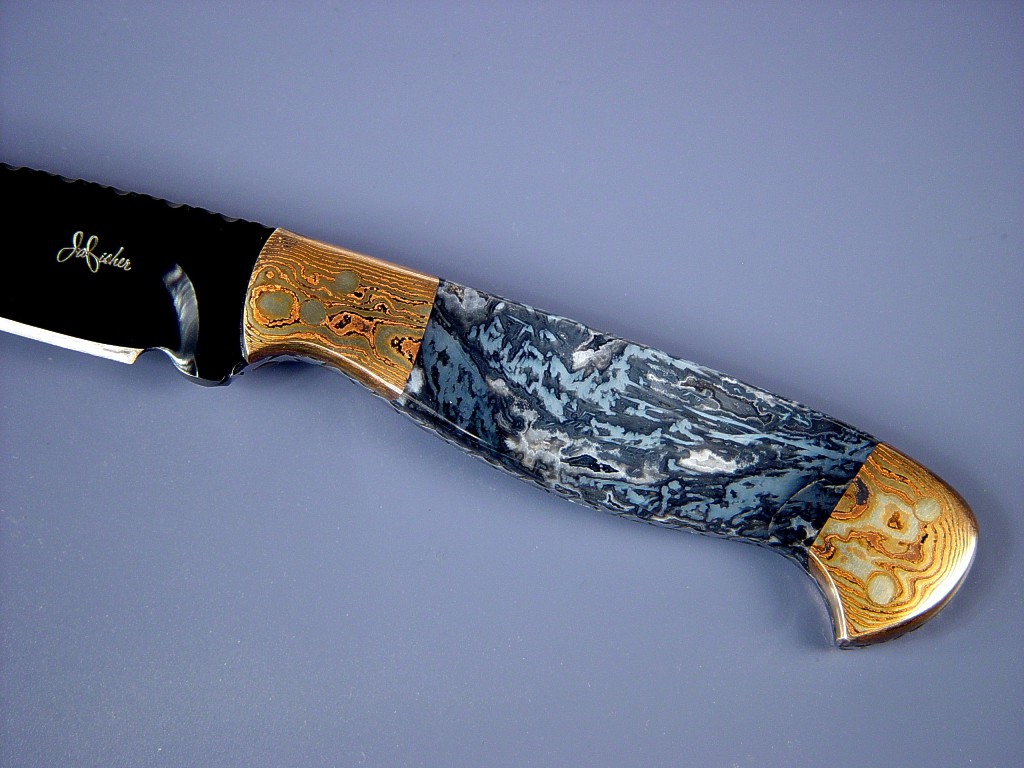 Fine Handmade Knife: "Tarazed" obverse side view: blued O-1 oil  hardening tool steel blade, Mokume Gane bolsters, Agate gemstone handle, Sharkskin inlaid in hand-carved leather sheath