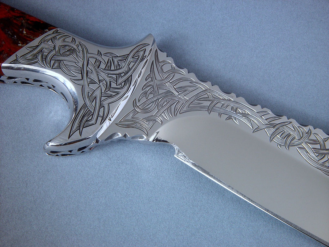 "Tribal" design in blade and bolsters is hand-engraved with carbide gravers, a very difficult and time-consuming process