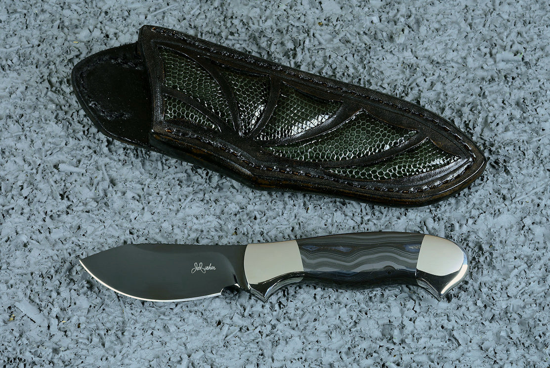 "Ullr", obverse side view in deep cryogenically treated O1 tungsten-vanadium alloy tool steel blade, 304 stainless steel bolsters, Silver Crown Psilomelane gemstone handle, hand-carved leather sheath inlaid with gray lizard skin
