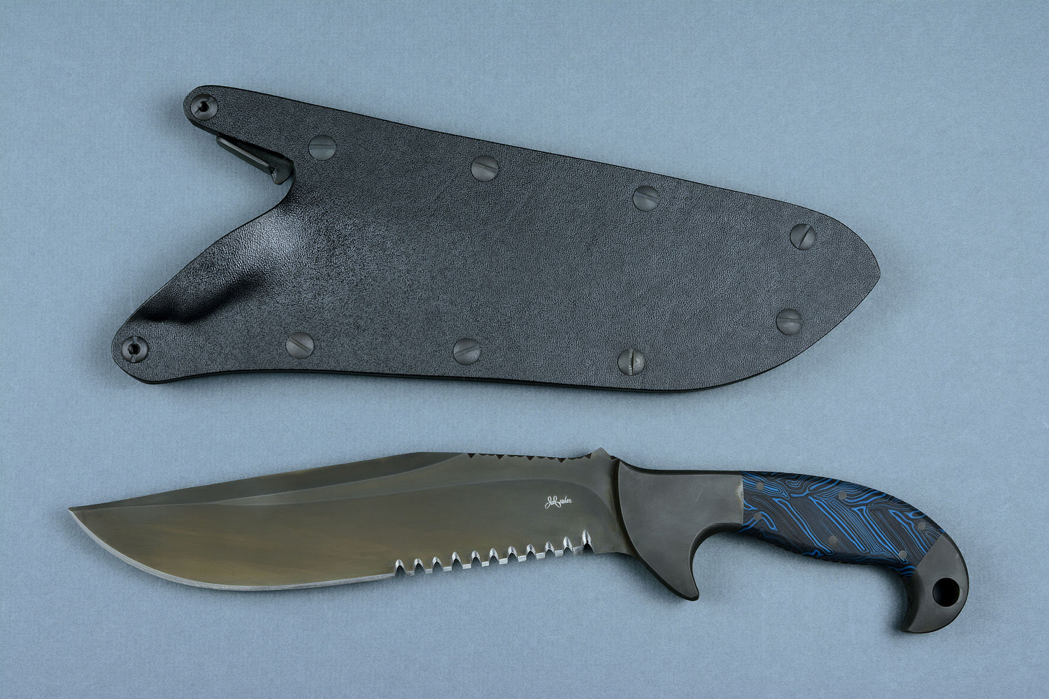 "Utamu" Custom Crossover, Survival, Tactial knife, obverse side view in T4 cryogenically treated CPM 154CM powder metal high molybdenum martensitic stainless steel blade, 304 stainless steel bolsters, blue/black G10 compos000ite handle, positively locking sheath of kydex, anodized aluminum, black oxide stainless steel, anodized titanium