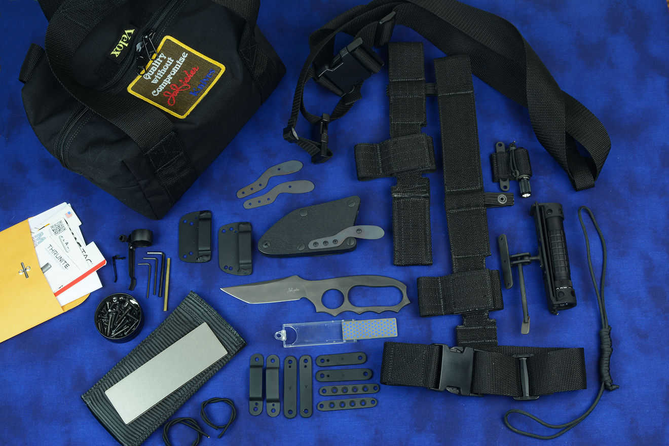 "Veloxi" complete tactical knife kit with knife, sheath, hardware, fasteners, straps, loops, UBLX, EXBLX, LIMA, two sharpeners, sternum harness, HULA, two flashlights, spare parts, lanyard, and duffle