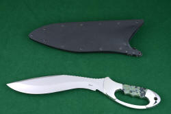 "Ananke" fine custom tactical khukri knife, obverse side with tactical locking sheath. A hybridized approach to kniefmaking, with high art and tactical necessity together