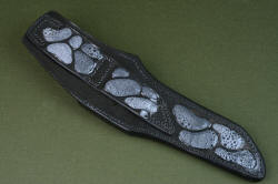 "Arctica" leather sheath back view. Sheath has multiple inlays of frog skin in hardened leather, with multiple row stitching of dual position belt loop
