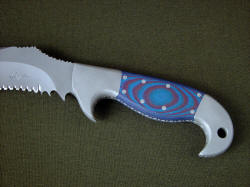 "Arcturus" obverse side handle detail. Handle scales are blue and red G10 fiberglass/epoxy composite laminate, extremely hard, tough and durable, secured with eight stainless steel pins