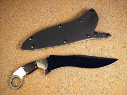 "Argiope" fine combat grade knife: reverse side view. Note substantial curves, in "gun-grip" style of handle angle