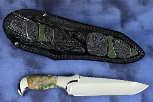 "Axia EL" fine handmade knife reverse side view  in T3 deep cryogenically treated CPM 154CM high mollybdenum powder metal technology martensitic stainless steel blade, 304 stainless steel bolsters, Linda Marie Moss Agate gemstone handle, hand-carved leather shoulder inlaid with green, black ray skin