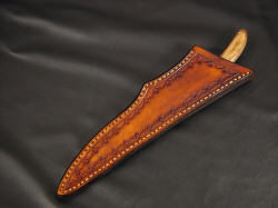 "Boning" custom chef's knife, sheathed view. Sheath is deep and protective, hand-stitched, lacquered and sealed