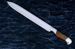 "Thresher" fine handmade chef's knife, BBQ knife, fillet knife, obverse side view in T3 cyrogenically treated 440C high chromium stainless steel blades, 304 stainless steel bolsters, Caprock petrified wood gemstone handles, Bison (American Buffalo), leather shoulder book case