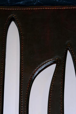"Bordeaux, Courbe Vaste, Thresher" fine handmade chef's knives, BBQ knives, book cases interior detail  in T3 cyrogenically treated 440C high chromium stainless steel blades, 304 stainless steel bolsters, Caprock petrified wood gemstone handles, Bison (American Buffalo), leather shoulder book case