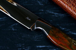"Thresher" fine handmade chef's knives, BBQ knives, maker's mark detail  in T3 cyrogenically treated 440C high chromium stainless steel blades, 304 stainless steel bolsters, Caprock petrified wood gemstone handles, Bison (American Buffalo), leather shoulder book case