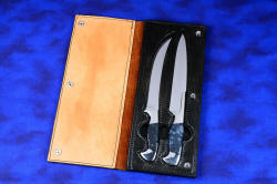"Bordeaux and Courbe" Professional grade chef's/BBQ knives, case in American Bison, heavy leather shoulder, stainless steel snaps, nylon stitching. 