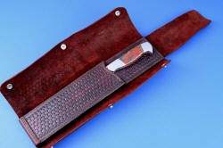 "Concordia" master chef's knife, sheathed view, open wrap. Internal sheath body is heavy, hardened 9-10 oz. shoulder, outer wrap is burgundy latigo side, tough and resilient