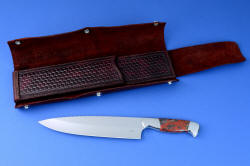 "Concordia" master chef's knife, obverse side, open chef's roll view. Interior heavy sheath with outer wrap of latigo leather secures knife  with safety and beauty