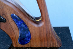 "Concordia" Custom Fine Chef's Knife, right side stand and base detail, showing bold gemstone form above walnut surface
