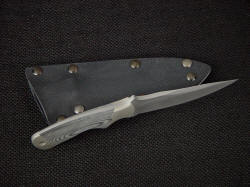 "Creature" tactical knife, spine view. Note fully tapered tang, dovetailed bolsters, clean and smooth lines of this tough knife