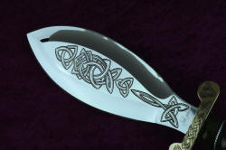 "Darach" celtic dagger, engraving, reflective, maker's mark view to show contrast of deep engraving on mirror polished high chromium stianless steel blade