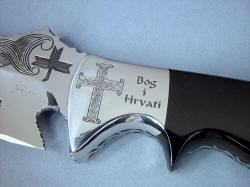 "Duhovni Ratnik" obverse side front bolster engraving detail. "God and Croatians" with ancient cross hand-engraved in stainless steel
