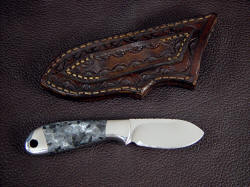 "Firefly" reverse side view. Sheath is stamp-tooled in front and back including belt loop, and is hand-stitched with polyester sinew