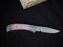 "Gemini" custom handmade linerlock folding knife, reverse side view. Knife has elegant and graceful lines