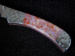 "Gemini" custom linerlock folding knife, obverse side handle detail. Confetti agate is brecciated microcrystalline quartz, extremely hard and tough