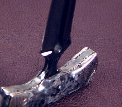 "Grim Reaper" black push dagger, filework inside handle tang detail. Tang is cold blued.