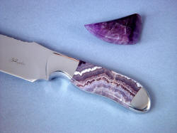 "Hestia" fine chef's knife obverse side view: Amethystine flow banding in gemestone is arching, crystalline form. 