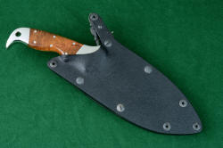 "Hooded Warrior" sheathed view, locking kydex sheath. This is the finest locking sheath made in the world, with all high strength anodized aluminum frame, double thickness kydex, and all blackened stainless steel mechanism and fasteners.