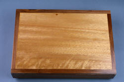"Kadi" case, top view. Single piece of meranti top is banded with black walnut for contrast.