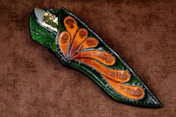"Kita" sheathed view. Sheath is deep and protective, with a high back and a glimpse of striking gemstone handle 