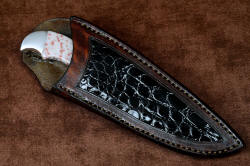 "Lacerta" fine handmade knife, sheathed view. Sheath is deep with a high back, large beautiful black glazed caiman skin inlays