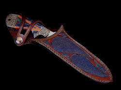 "Mountain Creature" sheathed view. Sheath retains knife, yet displays handle nicely.