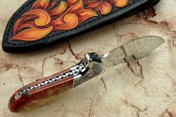 "Nunavut" inside handle tang detail. All surfaces are rounded, contoured, smoothed and polished for comfort and beauty