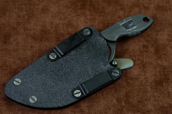 "Oculi" professional counterterrorism, tactical, working knife, sheath back detail. Several mounting positions are available for hardware on this reversible sheath