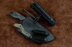 "Oculi" professional counterterrorism, tactical, working knife, shown with HULA rotated outward to show ball joint articulating fixture in stainless steel