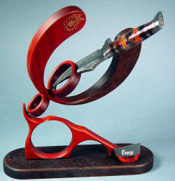 "Omega" in stand. Dynamic articulating stand can display the knife in a variety of positions, directions, and angles