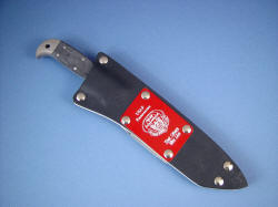 "PJLT" Pararescue Light CSAR knife, sheathed view. Sheath is tough and durable, with removeable engraved flasplate