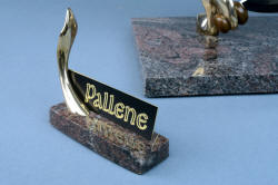 "Pallene" custom handmade knife sculpture, nameplate detail. Note reflection in polished surface of granite