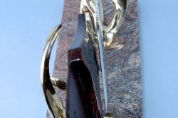 "Pallene" custom handmade knife sculpture, photo illustrates close fit of knife blade and sheath resting in bronze stand.