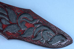 "Pallene" custom handmade knife sculpture, sheath front, lower tail area detail. Meticulous inlay of tough rayskin in leather in design form of engraving. 