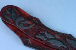 "Pallene" custom handmade knife sculpture, sheath belt loop detail. Inlays are balanced with hand-carved and tooled design, hand-dyed