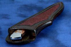 "Phact" fine handmade knife, sheath mouth detail. Welts are strong and stiff, rear curve allows knife to be unsheathed 