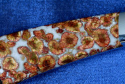 "Phact" fine handmade knife, 6x enlargement of reverse side gemstone handle scale in rare Indian Poppy Jasper 