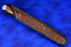 "Rebanador" Fine Custom Handmade knife, sheathed view. Sheath is long and large, solid and deep, with intricate carving and hand-dying